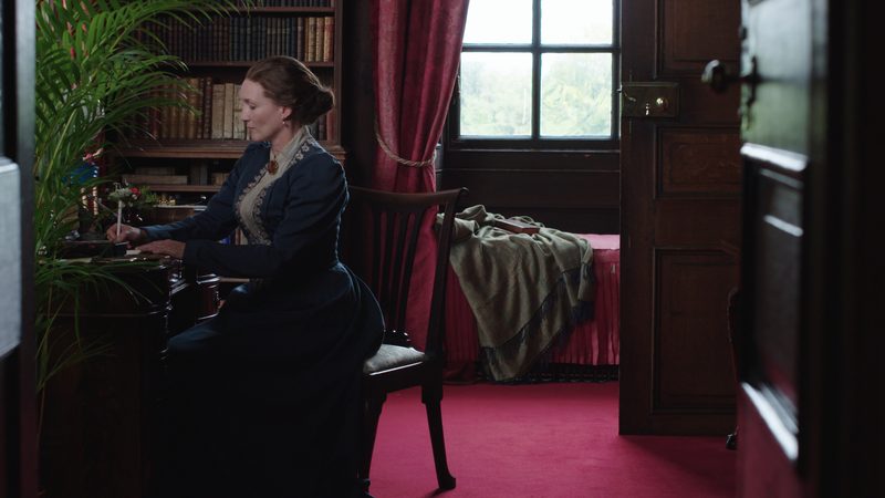 Woman writing at a table
